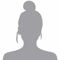 Silhouette of a person with a bun hairstyle and earrings, facing left.